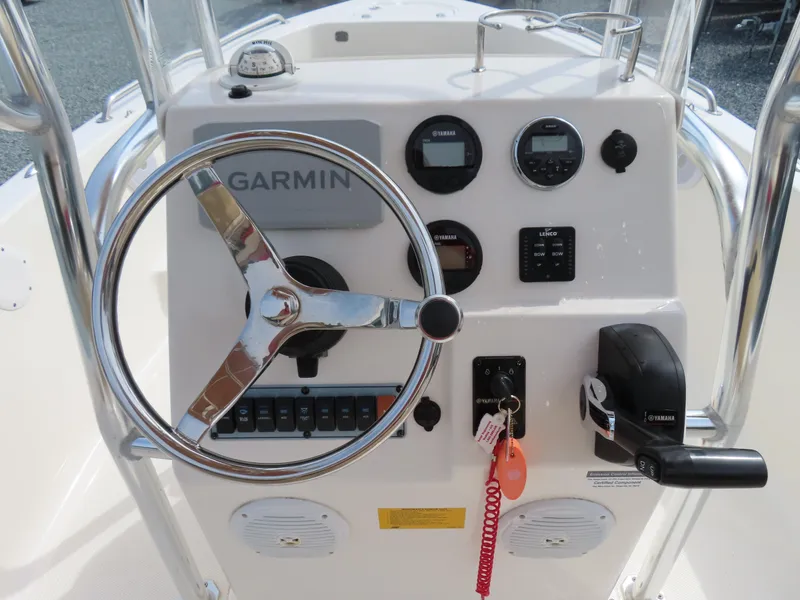 Slide: The Image of 2019 Key West 176 Center Console boat dashboard with Garmin navigation system and controls. - 20