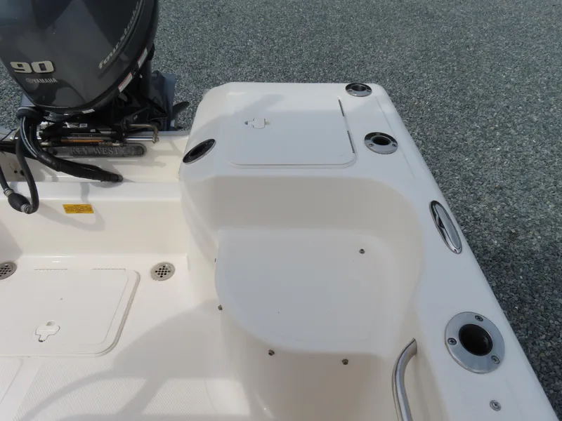 Slide: The Image of 2019 Key West 176 Center Console boat stern with motor and rod holders. - 27
