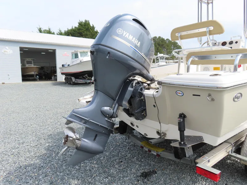 Slide: The Image of 2019 Key West 176 Center Console boat with Yamaha outboard motor in a boatyard. - 4