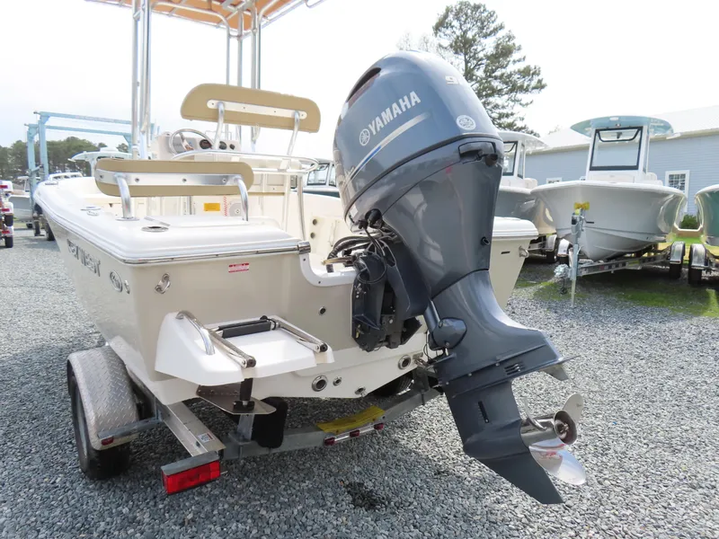 Slide: The Image of 2019 Key West 176 Center Console boat with Yamaha outboard motor on trailer. - 5
