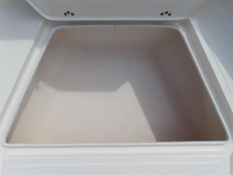 Slide: The Image of 2019 Key West 176 Center Console storage compartment, open and empty. - 9