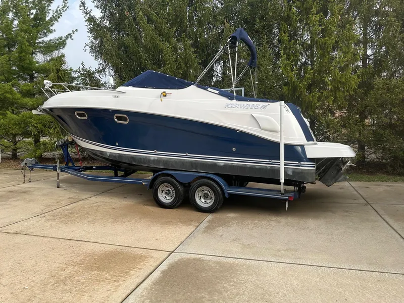 Slide: The Image of 2005 Four Winns 268 Vista boat on trailer, parked outdoors. - 2