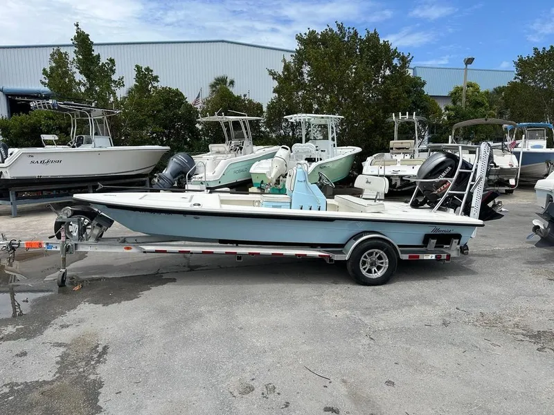 Slide: The Image of 2023 Maverick 18 HPX-V boat on trailer, surrounded by other boats in a marina. - 7