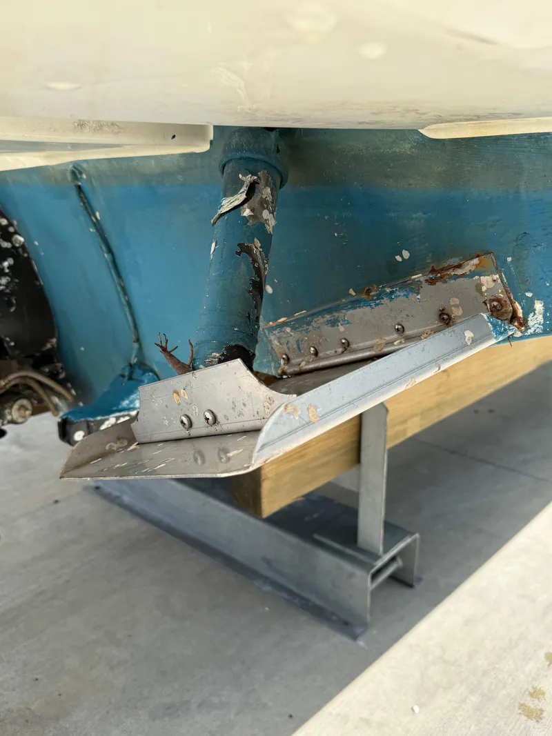 Slide: The Image of Damaged hull of 2014 Sea Ray 270 SLX boat on stand. - 13