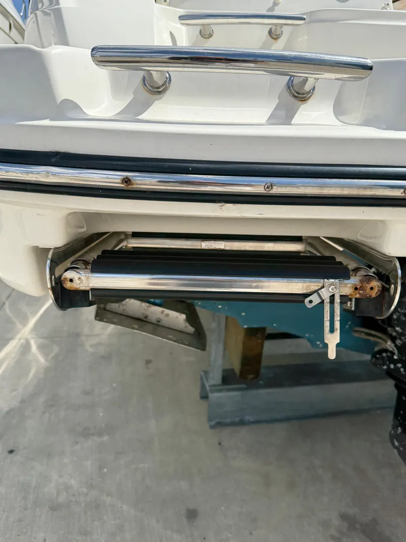 Slide: The Image of 2014 Sea Ray 270 SLX boat with stainless steel swim platform ladder. - 14