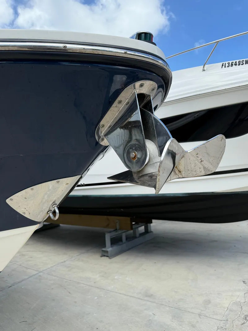 Slide: The Image of 2014 Sea Ray 270 SLX boat anchor detail with blue hull and clear sky background. - 3