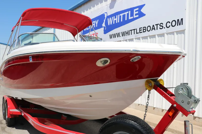 Slide: The Image of 2016 Chaparral 246 SSi boat in red on trailer, displayed at Whittle Boats dealership. - 11