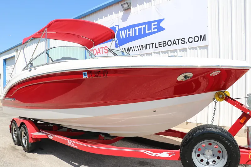 Slide: The Image of 2016 Chaparral 246 SSi boat in red on trailer at Whittle Boats dealership. - 12