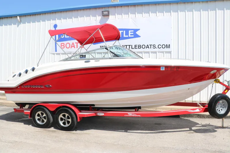 Slide: The Image of 2016 Chaparral 246 SSi boat with red hull and canopy on a matching trailer. - 14