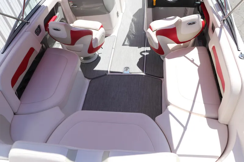 Slide: The Image of 2016 Chaparral 246 SSi boat interior with red and white seating arrangement. - 21