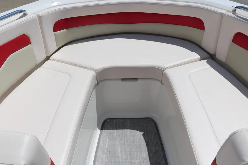 Slide: The Image of 2016 Chaparral 246 SSi boat interior with white and red seating. - 25