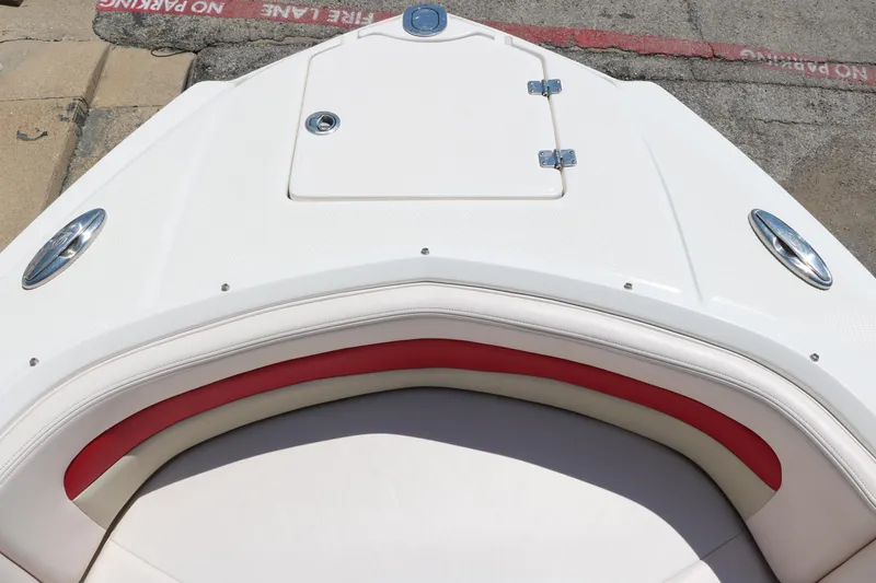 Slide: The Image of 2016 Chaparral 246 SSi boat bow with white and red seating. - 26