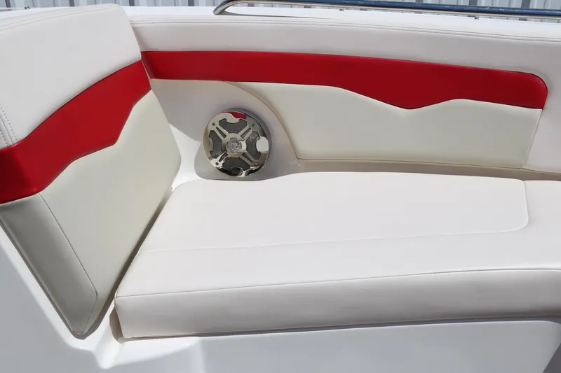 Slide: The Image of 2016 Chaparral 246 SSi boat interior with white and red seating and speaker. - 30