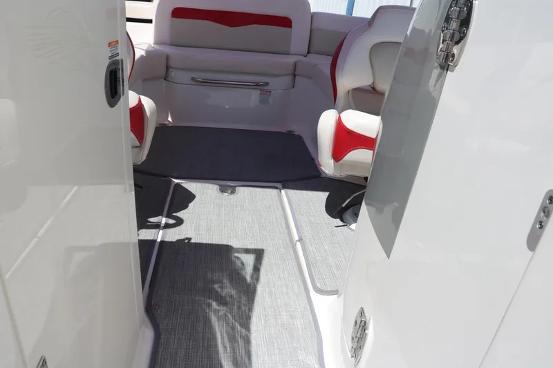 Slide: The Image of Interior of 2016 Chaparral 246 SSi boat with red and white seating. - 31