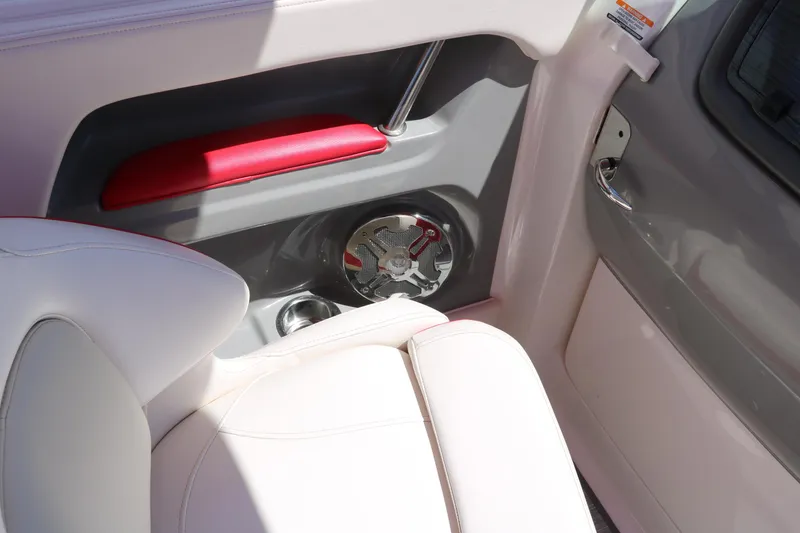 Slide: The Image of Interior of 2016 Chaparral 246 SSi boat with white seating and speaker. - 35