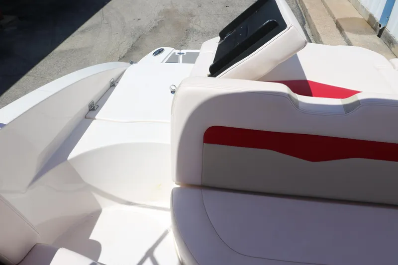 Slide: The Image of 2016 Chaparral 246 SSi boat interior with white and red seating. - 39