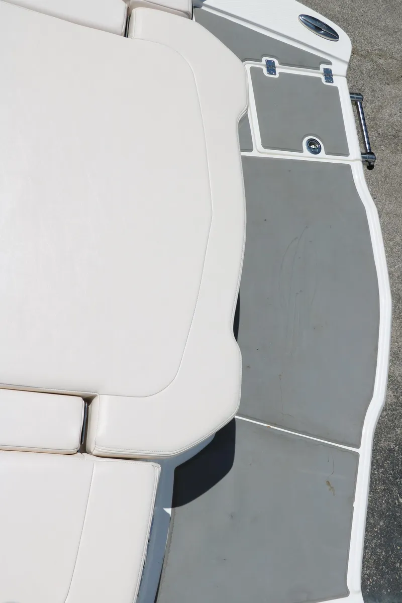Slide: The Image of 2016 Chaparral 246 SSi boat deck with gray and white seating. - 41