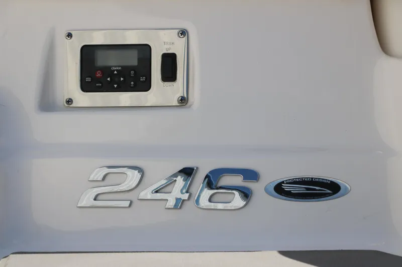 Slide: The Image of 2016 Chaparral 246 SSi boat dashboard with control panel and model emblem. - 5