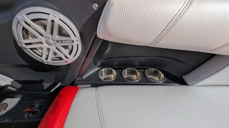 Slide: The Image of 2015 MasterCraft X10 interior with JL Audio speaker and cup holders. - 26