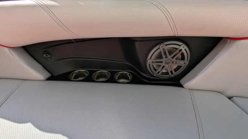 Slide: The Image of 2015 MasterCraft X10 interior with speaker and cup holders. - 27