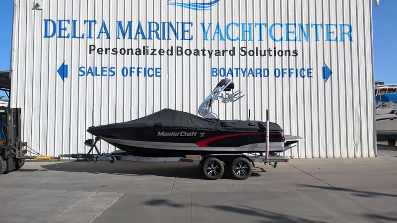 Slide: The Image of 2015 MasterCraft X10 boat on trailer at Delta Marine Yacht Center. - 33