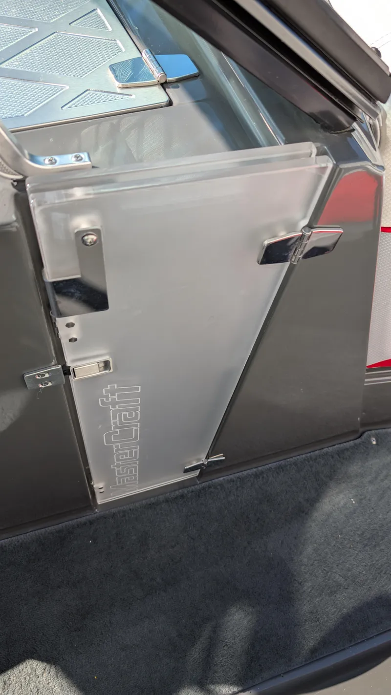 Slide: The Image of 2015 MasterCraft X10 boat interior detail with sleek metallic finish and modern design elements. - 40