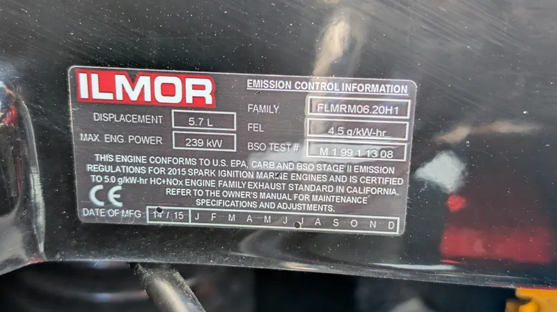 Slide: The Image of 2015 MasterCraft X10 engine label showing Ilmor emission control information and specifications. - 45