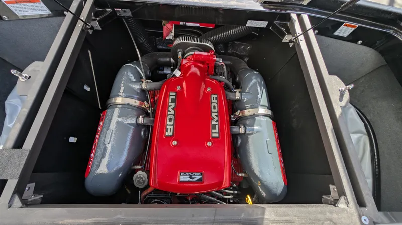 Slide: The Image of 2015 MasterCraft X10 engine, Ilmor MV8, red and gray components, top view. - 47