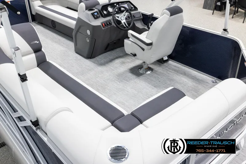 Slide: The Image of 2025 Bennington 20 SLSE pontoon boat interior with plush seating and modern helm. - 11