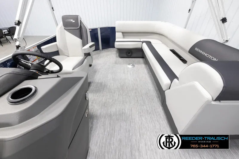 Slide: The Image of 2025 Bennington 20 SLSE pontoon boat interior with gray seating and steering console. - 14