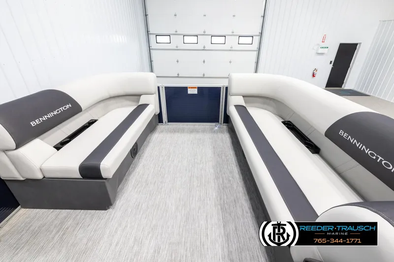 Slide: The Image of 2025 Bennington 20 SLSE pontoon boat interior with gray seating and logo. - 18