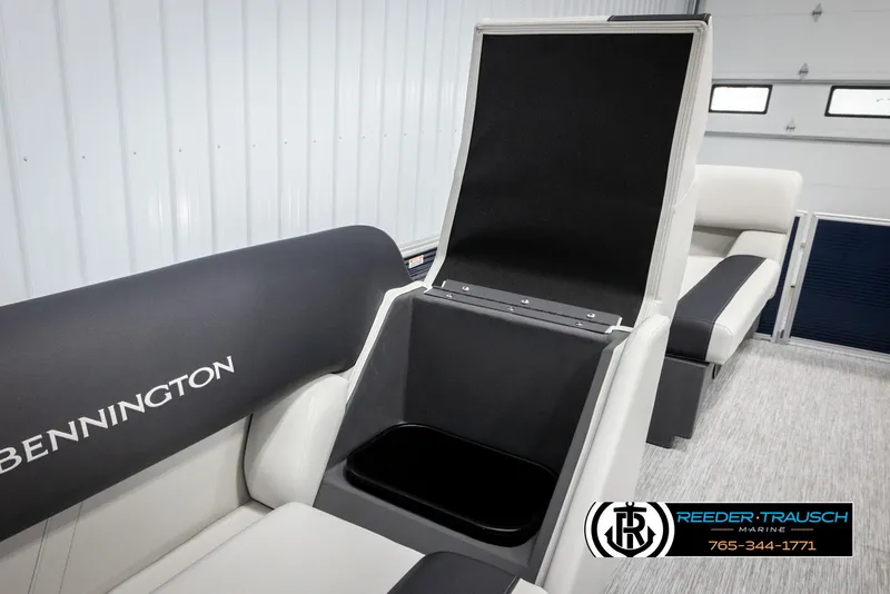Slide: The Image of 2025 Bennington 20 SLSE boat interior with open storage compartment, showcasing sleek seating design. - 22