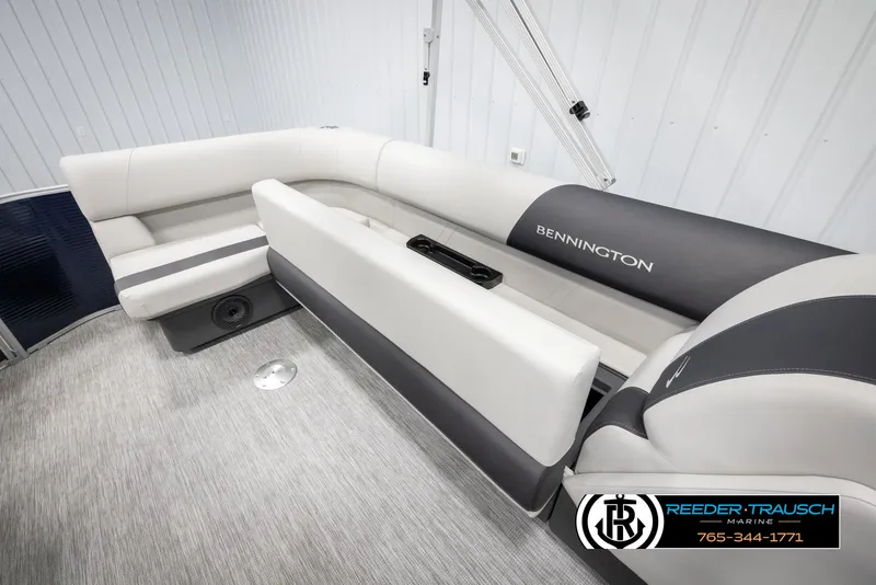Slide: The Image of 2025 Bennington 20 SLSE pontoon boat interior with plush seating and modern design. - 25