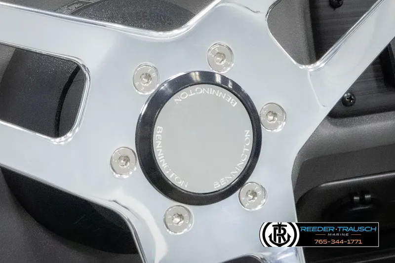 Slide: The Image of 2025 Bennington 20 SLSE steering wheel with chrome finish and logo detail. - 29