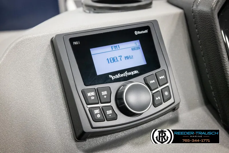 Slide: The Image of 2025 Bennington 20 SLSE boat stereo system with Bluetooth and FM radio display. - 30