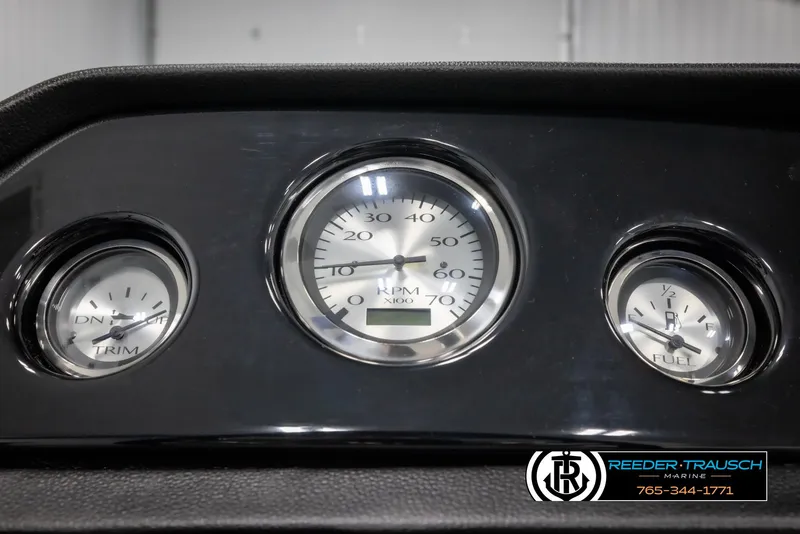 Slide: The Image of Dashboard gauges of a 2025 Bennington 20 SLSE boat, featuring RPM and trim indicators. - 31