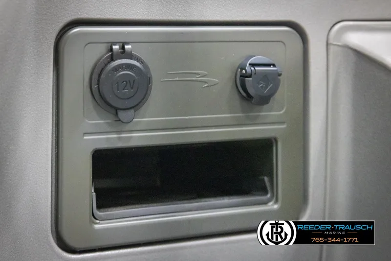 Slide: The Image of 12V power outlets on 2025 Bennington 20 SLSE boat dashboard. - 34