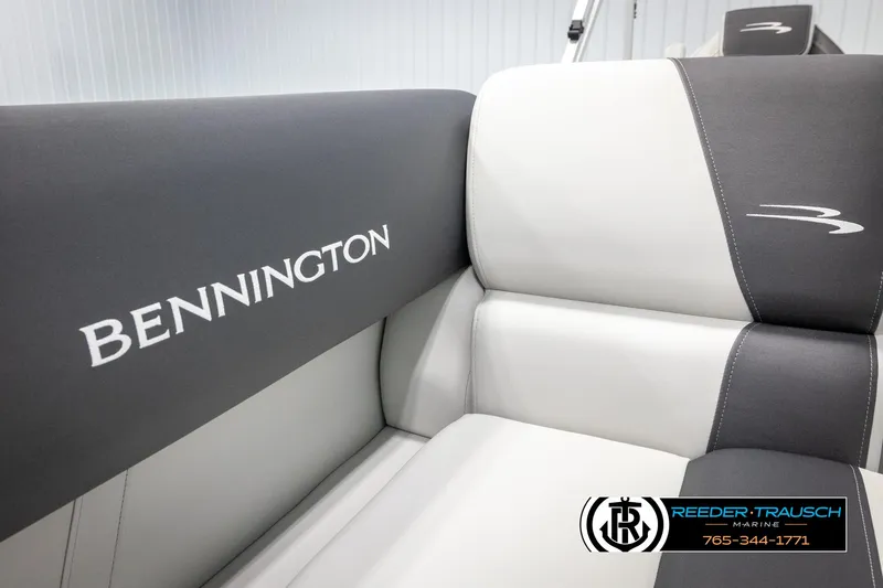 Slide: The Image of 2025 Bennington 20 SLSE boat interior with branded seating, featuring sleek gray and white upholstery. - 37