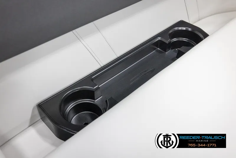 Slide: The Image of 2025 Bennington 20 SLSE boat interior cup holders on white seating. - 38