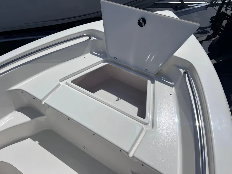 Slide: The Image of 2024 Key West 189 FS boat with open storage compartment on deck. - 12