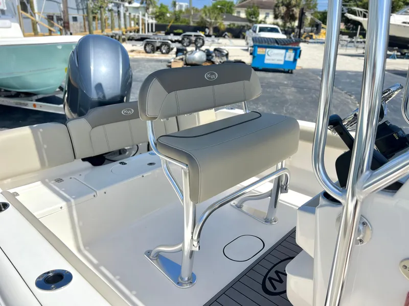 Slide: The Image of 2024 Key West 189 FS boat interior with seating and console details. - 16