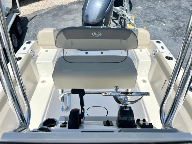 Slide: The Image of 2024 Key West 189 FS boat interior with steering wheel and seating. - 17