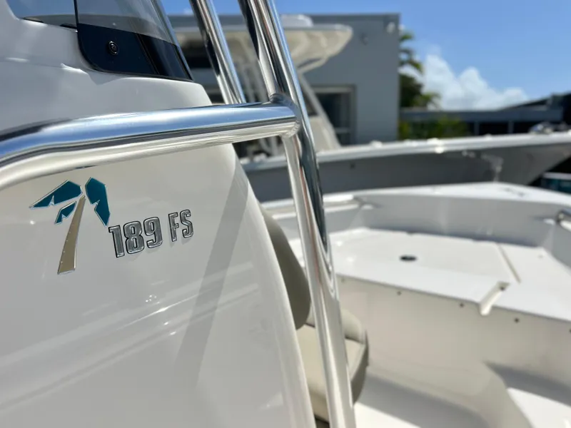 Slide: The Image of 2024 Key West 189 FS boat, close-up of logo and seating area. - 19