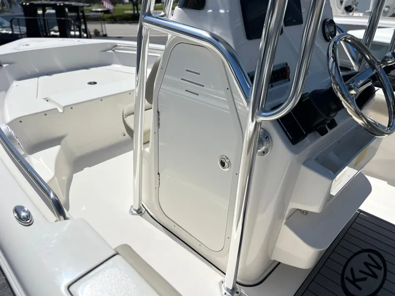 Slide: The Image of 2024 Key West 189 FS boat interior with steering console and stainless steel railings. - 20