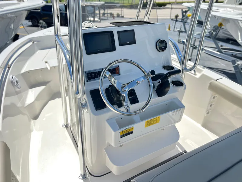 Slide: The Image of 2024 Key West 189 FS boat console with steering wheel and navigation screens. - 22