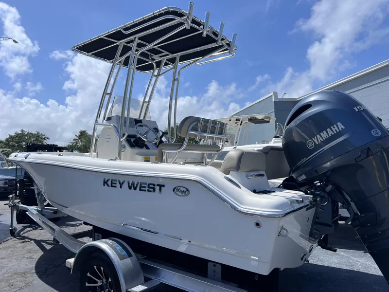 Slide: The Image of 2024 Key West 189 FS boat with Yamaha engine on trailer, under blue sky. - 3