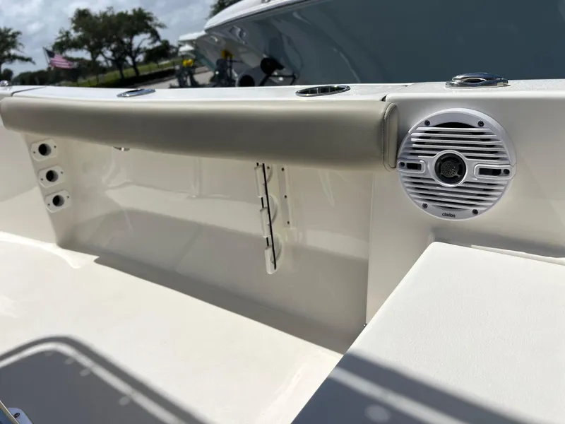 Slide: The Image of 2024 Key West 189 FS boat interior with speaker and cushioned seating. - 30