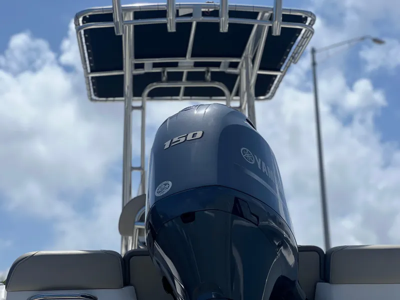 Slide: The Image of 2024 Key West 189 FS boat with Yamaha 150 engine under a blue sky. - 5