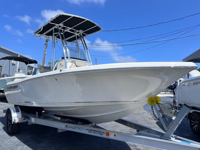 Slide: The Image of 2024 Key West 189 FS boat on trailer under clear blue sky. - 7