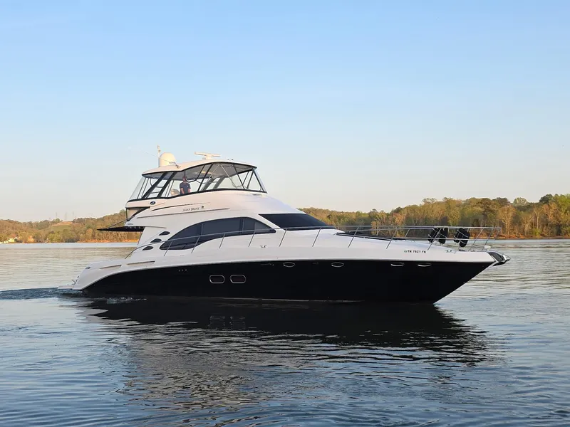 The Image of 2006 Sea Ray 58 Sedan Bridge yacht cruising on calm water. - 0